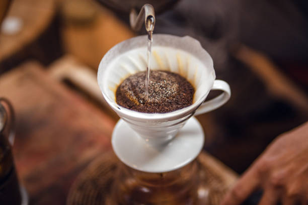 istock Closeup of hands barista make coffee 1457267020