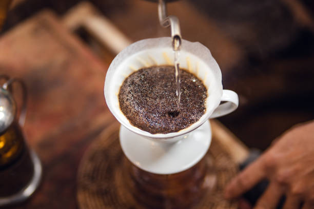 istock Closeup of hands barista make coffee 1457267110