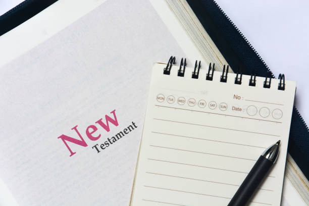istock New testament cover in Holy Bible with notebook and pen 1457270752