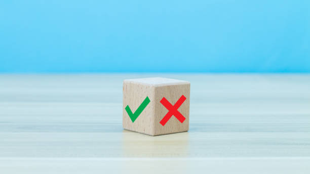 istock True and false symbols accept rejected for evaluation, Yes or No on wood blogs on blue background. 1457273332