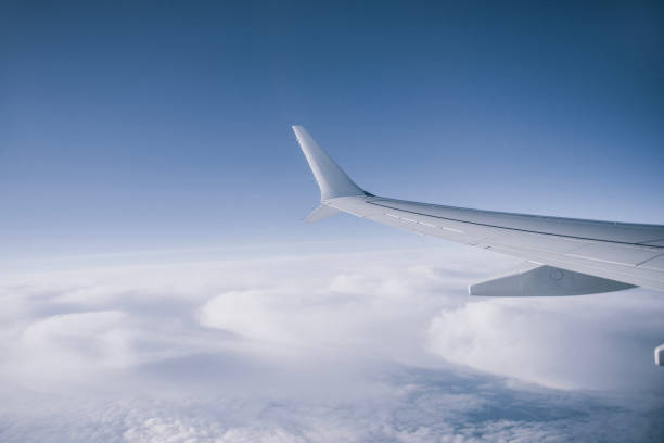 Free Stock Photo of Plane Flying Through Cloudy Blue Sky | Download ...