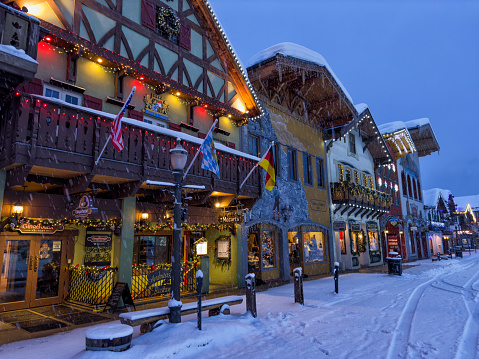 Street and buildings with Christmas lighting decoration in a snowy morning in Bavarian themed town of Leavenworth, Washington, USA