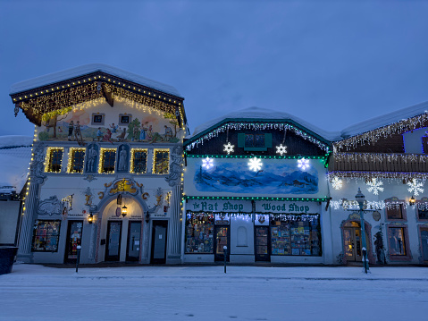 Street and buildings with Christmas lighting decoration in a snowy morning in Bavarian themed town of Leavenworth, Washington, USA