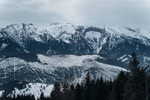 istock Beautiful rock and mountains covered with a snow 1457283657