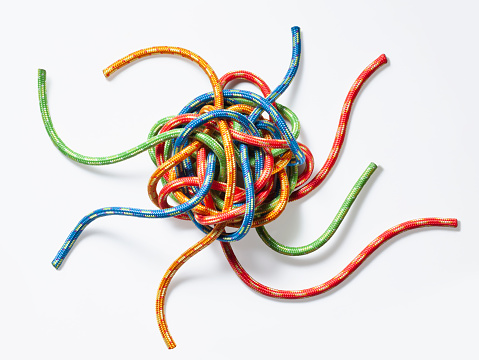 The concept of choice. Tangled colorful strings.