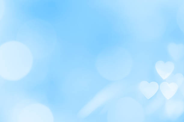 istock Blue background with heart shaped bokeh and space for copy 1457285296