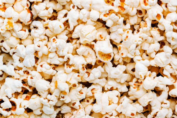 istock Salted popcorn background or texture, close-up, top view 1457286187