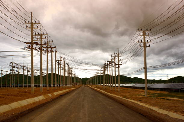 istock Road to the mountain in solar farm 1457287685