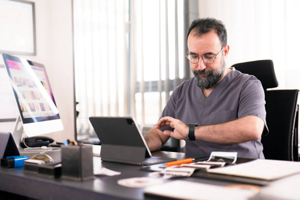 istock Obgyn working on his desk, Doctor's Office 1457288879