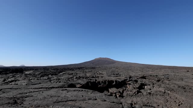 Views across the black lava volcano field of Jabal Qidr in the Harrat Khaybar region, north west Saudi Arabia