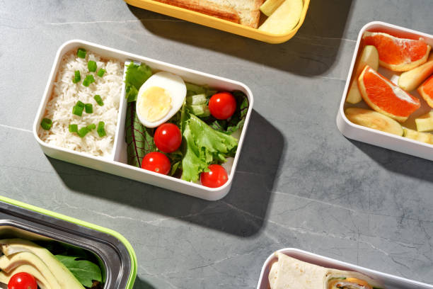 istock Containers with healthy food on gray background top view. 1457295586
