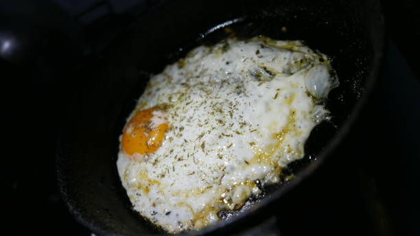 istock Food time. Fried egg ready to eat.  Making eggs for dinner 1457296709
