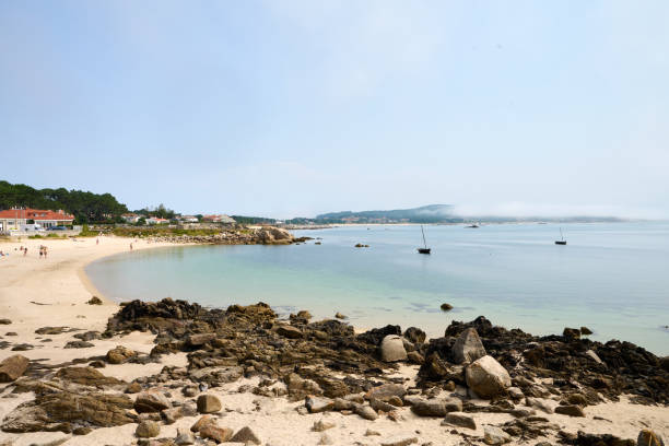 istock Galician beach with rocks and blue sky. Nature background. 1457296778
