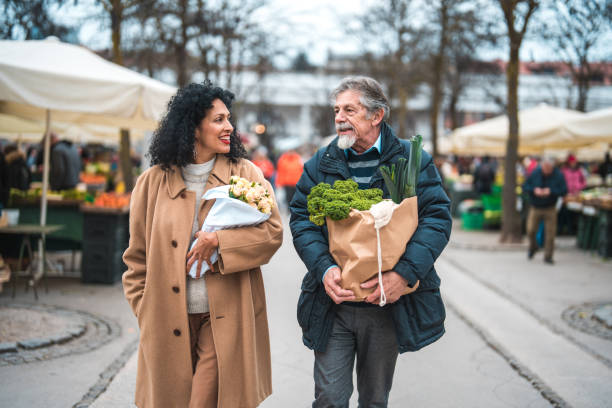 istock Weekend Couple Routine, Getting Flowers and Groceries 1457297693