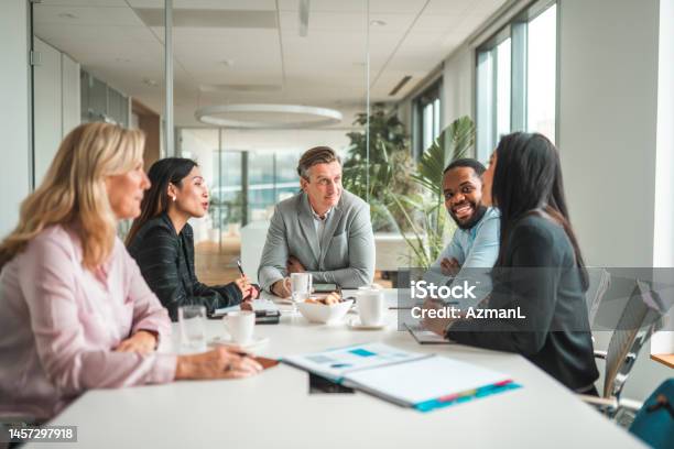 Successful Mid Adult Ceos Meeting In International Corporation Stock Photo - Download Image Now