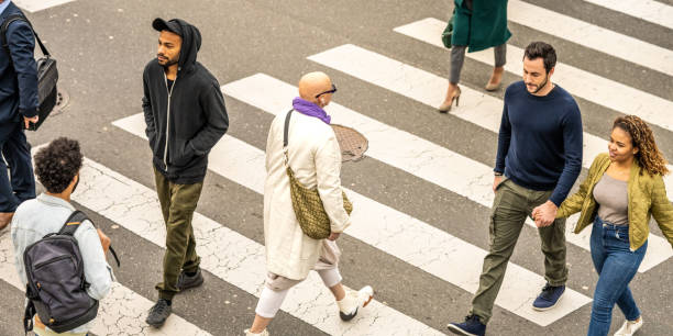 istock Crowd crossing road at crosswalk top view 1457298165