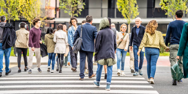 istock People crowd rushing across zebra, long angle view 1457298167