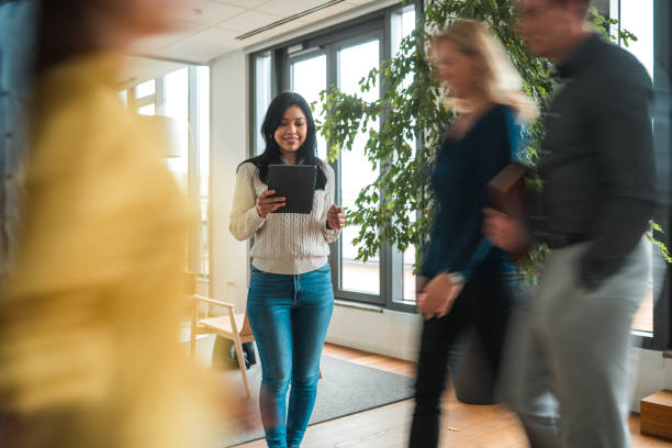 istock Focused Latina in Office Common Room 1457298354