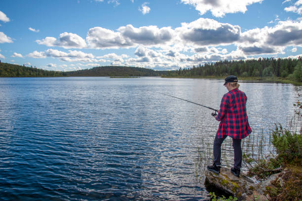 istock Woman fishing 1457301767