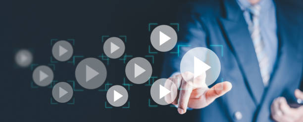 istock Video on demand technology with person touching play button on virtual screen to watch online VOD streaming of movie or TV . 1457303014