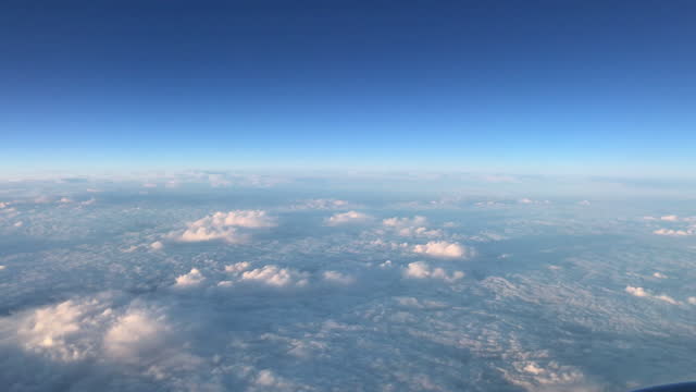 Massive white clouds seen from above, from an airplane