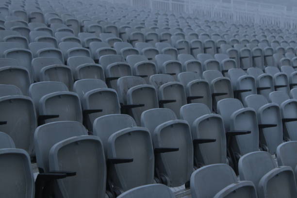 istock Tribune sports stadium, gray chairs arranged in rows 1457305241