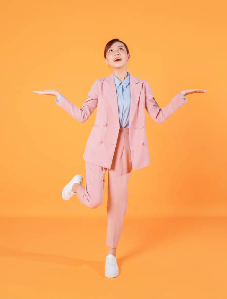 istock Young Asian businesswoman standing on background 1457305580