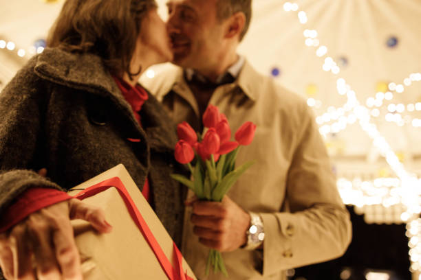 Valentine's day background. Composition of red hearts in flowers on a red background. Copy space