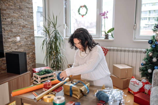 istock Young woman preparing gifts 1457311364