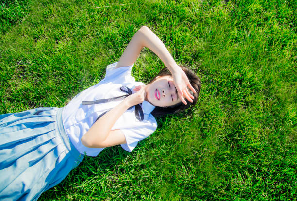 The girl lying on the grass