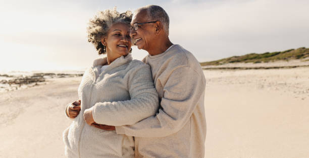 istock Mature romance at the beach 1457313306