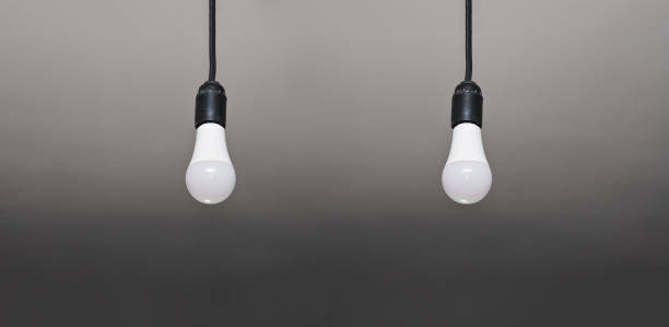 istock two LED lamps hang on wires. 1457314826