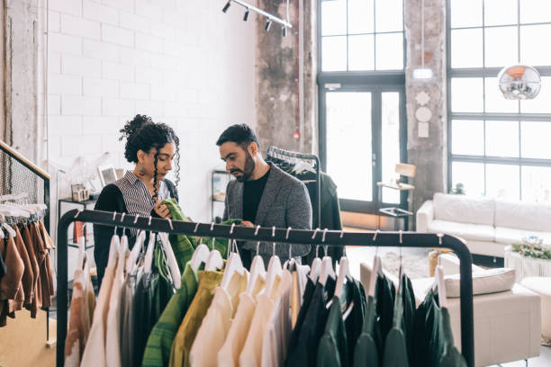 istock Female tailor helping Indian customer in her store 1457314855
