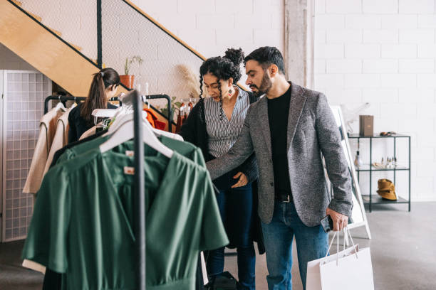 istock Female tailor helping Indian customer in her store 1457314860