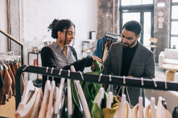 istock Female tailor helping Indian customer in her store 1457314862
