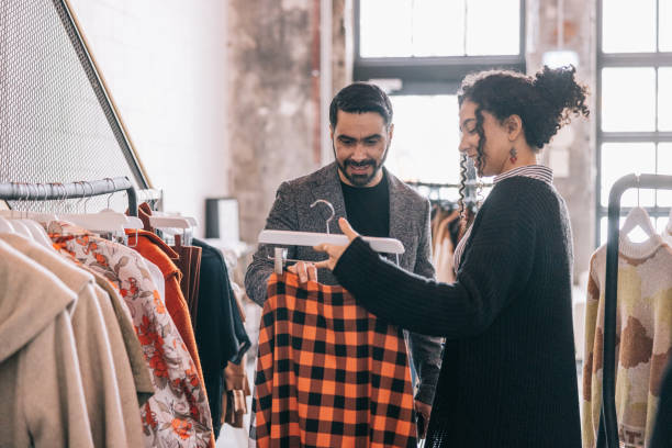 istock Shopkeeper helping Indian businessman in her store 1457314864