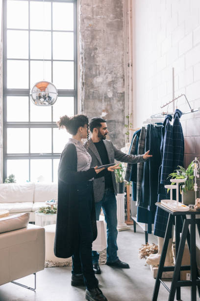 istock Indian businessman asking for help while shopping for new clothes 1457314877