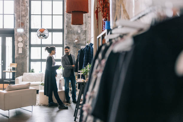 istock Shopkeeper helping Indian businessman in her store 1457314905