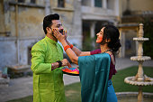 indian-couple-enjoying-holi-festival-in-the-courtyard-of-a-palace-in-rajasthan.jpg?b=1&s=170x170&k=20&c=PHON4HwXZOwjK6p41afzl_2TWxYxEh-tiG7Jisqj2Ss=