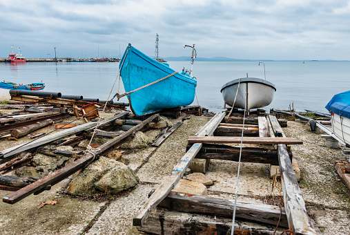 Fishing boats on the shore in Pomorie town. Bulgaria, Europe.