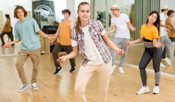 istock Smiling teenage girl practicing vigorous dance in studio 1457327790