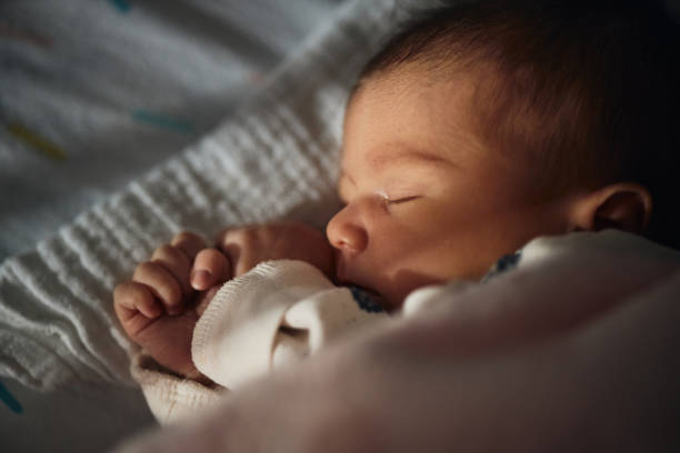 istock Sleeping newborn baby girl 1457329915