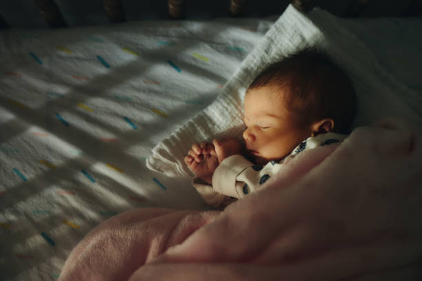 Sleeping newborn baby girl stock photo