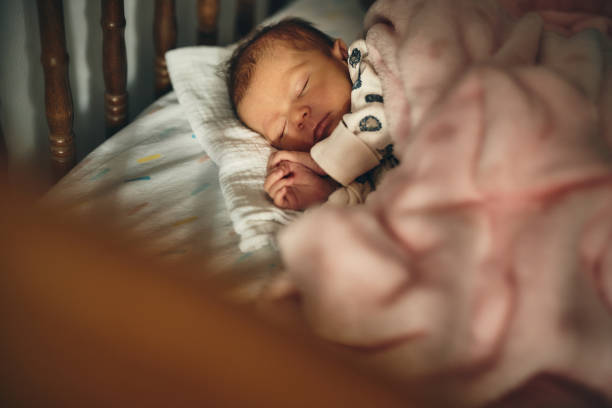 istock Sleeping newborn baby girl 1457330000