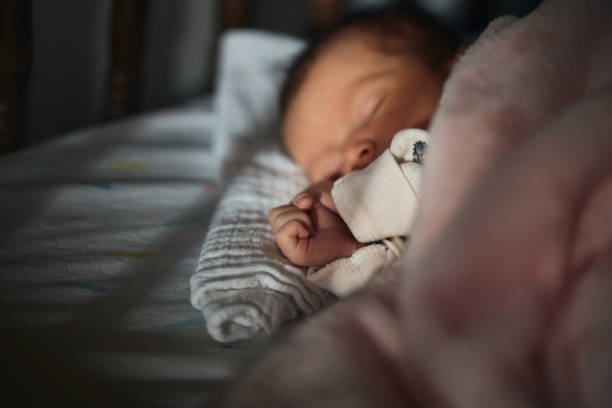 istock Sleeping newborn baby girl 1457330140
