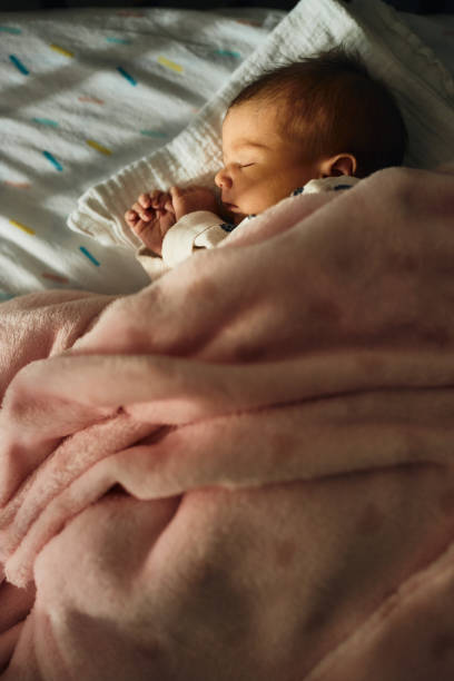 istock Sleeping newborn baby girl 1457330303