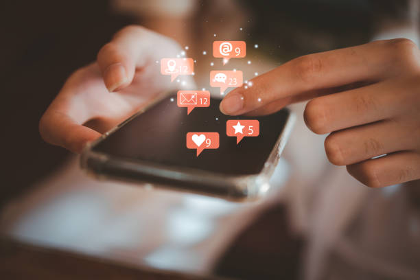 istock woman using mobile smart phone Social media chat message and Marketing network internet online concept. 1457331245