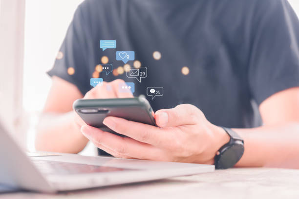 istock man using mobile smart phone Social media chat message and Marketing network internet online concept. 1457331270