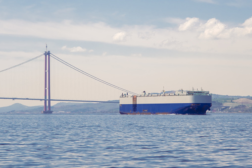 Large RoRo (Roll on/off) Vehicle carrier with Dardanelles 1915 Canakkale Bridge