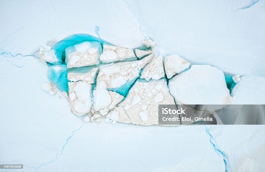 icebergs melting in a blue lagoon top view of icebergs melting in a blue lagoon in the arctic. Greenland Melting Stock Photo